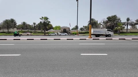 Dubai, UAE - May 26, 2026: Traffic on a road in Palm Jumeirah with modern s.. Stock Footage 335699149