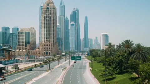 Dubai, UAE - May 5, 2024: Dubai cityscape with modern skyscrapers, highway with Stock Footage 287609372
