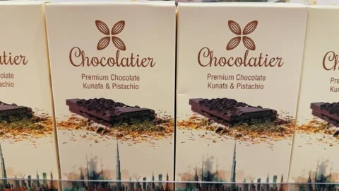 Dubai, Uae - Oct 15, 2024: Dubai Chocolate bar with green kadayif and pistach Stock Footage 288497648