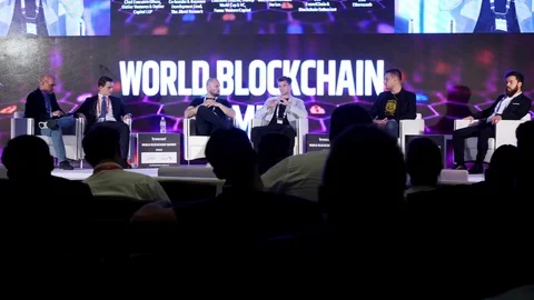DUBAI, UAE - OCTOBER 12, 2017: World blockchain, Speakers Giving a Talk at Stock Footage 83561981
