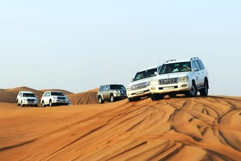 DUBAI, UAE - SEPTEMBER 12: The Dubai desert trip in off-road car is major tou Stock Photos