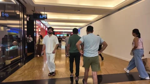Dubai, UAE - September 29, 2026 - Interior view of shoppers and visitors wa.. 스톡 동영상 346731644