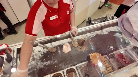 Dubai, UAE - September 29, 2026 - Interior view of Cold Stone Creamery in M.. Stock Footage 346758894