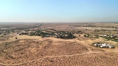 Dubai, United Arab Emirates: Aerial view of desert oasis Bab Al Shams Stock Footage 306595853