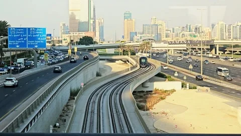 Dubai's modern cityscape featuring elevated metro tracks 스톡 동영상 321820349
