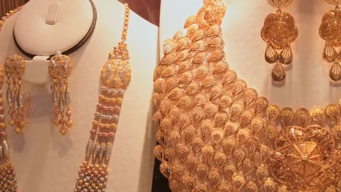 Dubau, UAE - 15th january, 2026: Ornate gold necklaces and earrings on disp.. Stock Footage 331991933