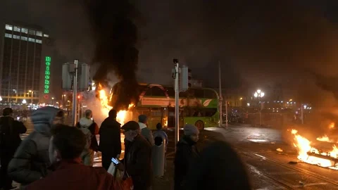 Dublin Bus burns during the Dublin Riots of 2023 on O'Connell Street Stock Footage 346229697