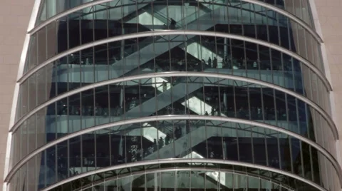 The Dublin convention centre. Tight shot showing people moving on escalators Stock Footage 42140398