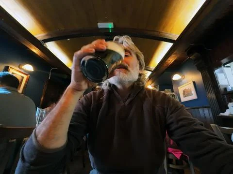 Dublin Pub Man drinks a Local beer Stock Photos