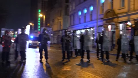 DUBLIN RIOT 2023: Protester Throws Object at Garda Public Order Unit Stock Footage 346232044