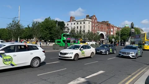 Dublin TFI double decker bus and taxis on O'Connell bridge. Dublin, Ireland Stock Footage 247549330