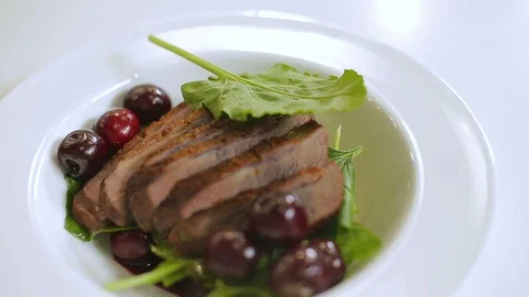 Duck breast with cherries - dish presentation Stock Footage 92913100