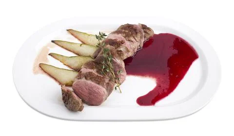 Duck breast with raspberry sauce. Stock Photos