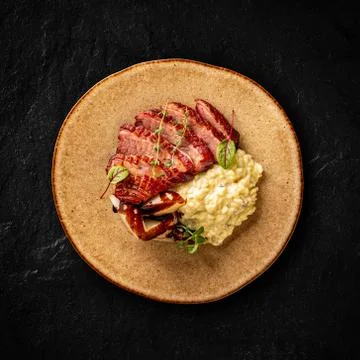 Duck breast with risotto Stock Photos