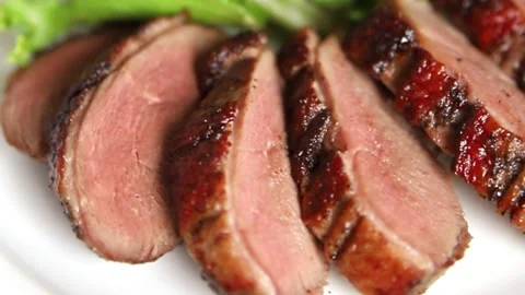 Duck breast slice roasted poultry meat main course tasty snack food Stock Footage 331295469