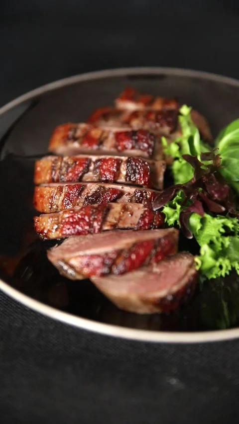 Duck breast slice roasted poultry meat main course tasty snack food Stock Footage 331295470