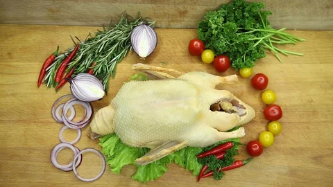 Duck decorated with vegetables from the chef in its raw form. Stock Footage 130002993