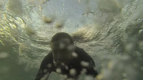 Duck diving a big wave. HD Slow Motion Stock Footage 44619290