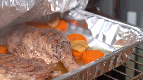 Duck leg with vegetables is prepared for baking. Stock Footage 254979138