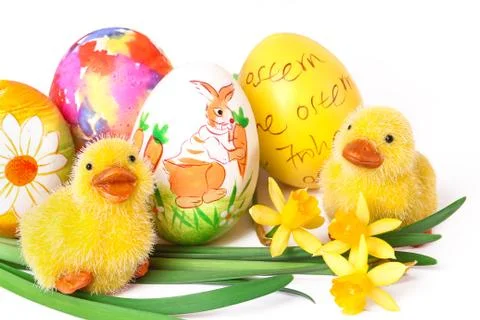 Ducklings with easter eggs and narcissus Stock Photos