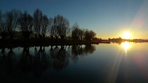 Ducks at the lake during sunset 動画素材 260260376