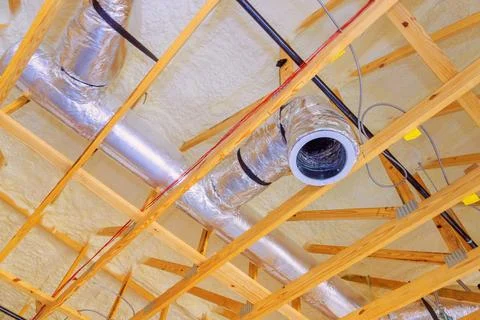 Ductwork installation in residential ceiling during home renovation in modern 库存照片