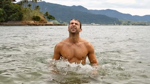 Dude emerging from sea Video stock 93995605