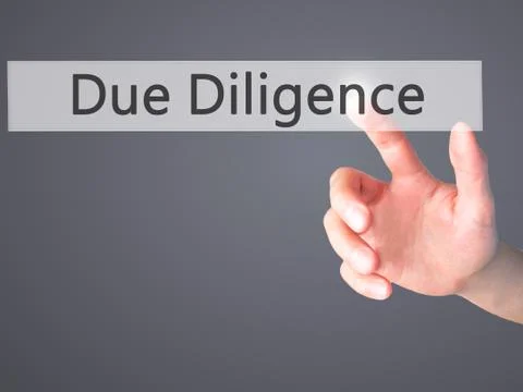 Due Diligence - Hand pressing a button on blurred background concept on visua Stock Photos