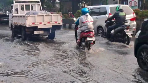 Due to high rainfall,waterways overflow in the street Stock Footage 292405990