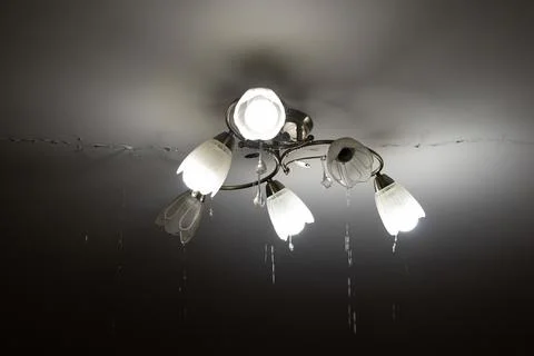 Due to a pipe break, there was a flood in the apartment upstairs and water .. Stock Photos