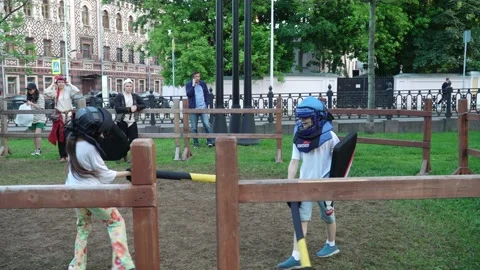 Duel of children in protective suits 스톡 동영상 217395626