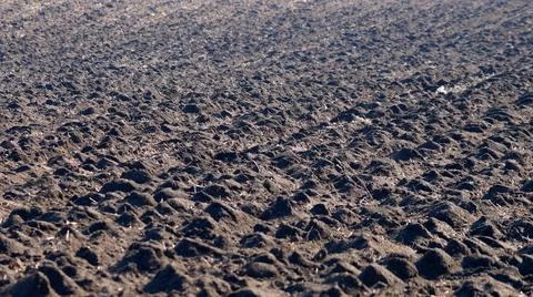 Dug up spring field ground texture for natural background Stock Photos
