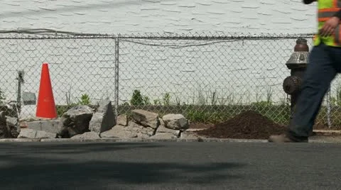 Dugup sidewalk between fire hydrand and work cone Stock Footage 11025549