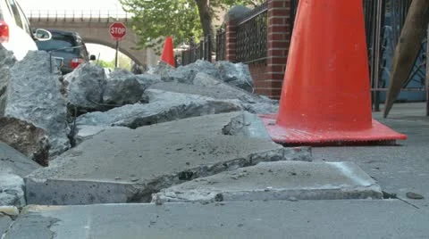 Dugup sidewalk with orange work cones Stock Footage 11024299