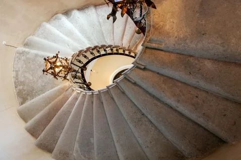 Duino, Italy - August 24, 2008: Spiral staircase in the Duino Castle, with wr Stock Photos