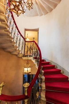 Duino, Italy - August 24, 2008: Spiral staircase in the Duino Castle, with wr Stock Photos