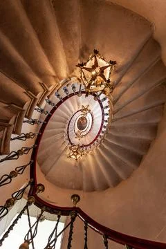 Duino, Italy - August 24, 2008: Spiral staircase in the Duino Castle, with wr Stock Photos