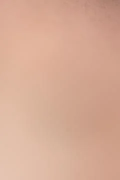 A dull beige background with minimal texture Stock-Fotos