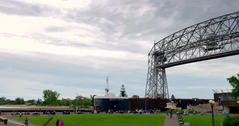 DULUTH, MN - 17 JUN 2024: Ship leaves Duluth Harbor under Lift Bridge Stock Footage 282621988