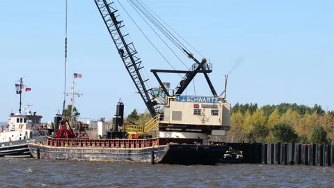 DULUTH, MN - 5 OCT 2020: Working crane on a floating dredging barge. Stock Footage 148357630
