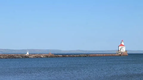 DULUTH, MN - 5 OCT 2020: Wisconsin Point with sailboat and lighthouse. Stock Footage 148357886