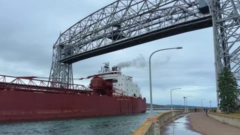 DULUTH, MN - 6 SEP 2023: Mesabi Miner, ore freighter ship under bridge Stock Footage 260680541