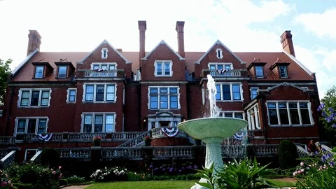 DULUTH, MN - JULY 1, 2018: Fountain in flower garden at Glensheen mansion Stock Footage 92370727