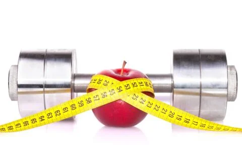 Dumbbell and an apple Stock Photos