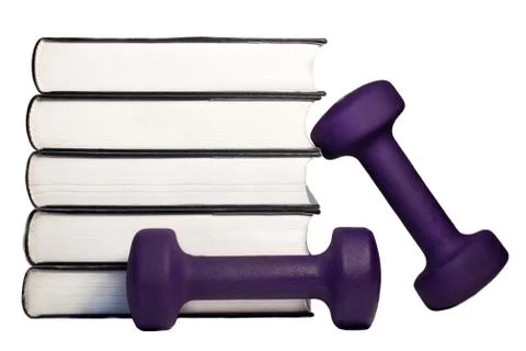 A dumbbell and stack of books for the concept of learning to be fit and healt Stock Photos