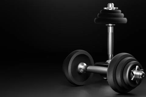 Dumbbell in dark background. Closeup and copy space on left. Stock Illustration