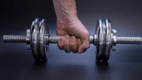 Dumbbell in hand (2) Stock Photos