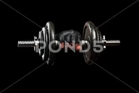 Dumbbell in hand Stock Photos