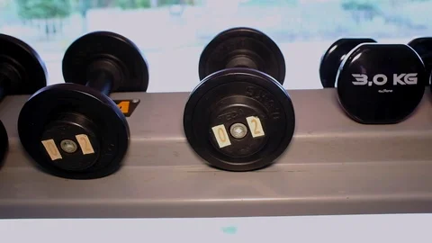 Dumbbell on the rack in the gym Stock Footage 126222299