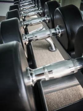 Dumbbell on rack Stock Photos